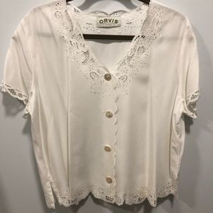 Orvis off-white cutout blouse.